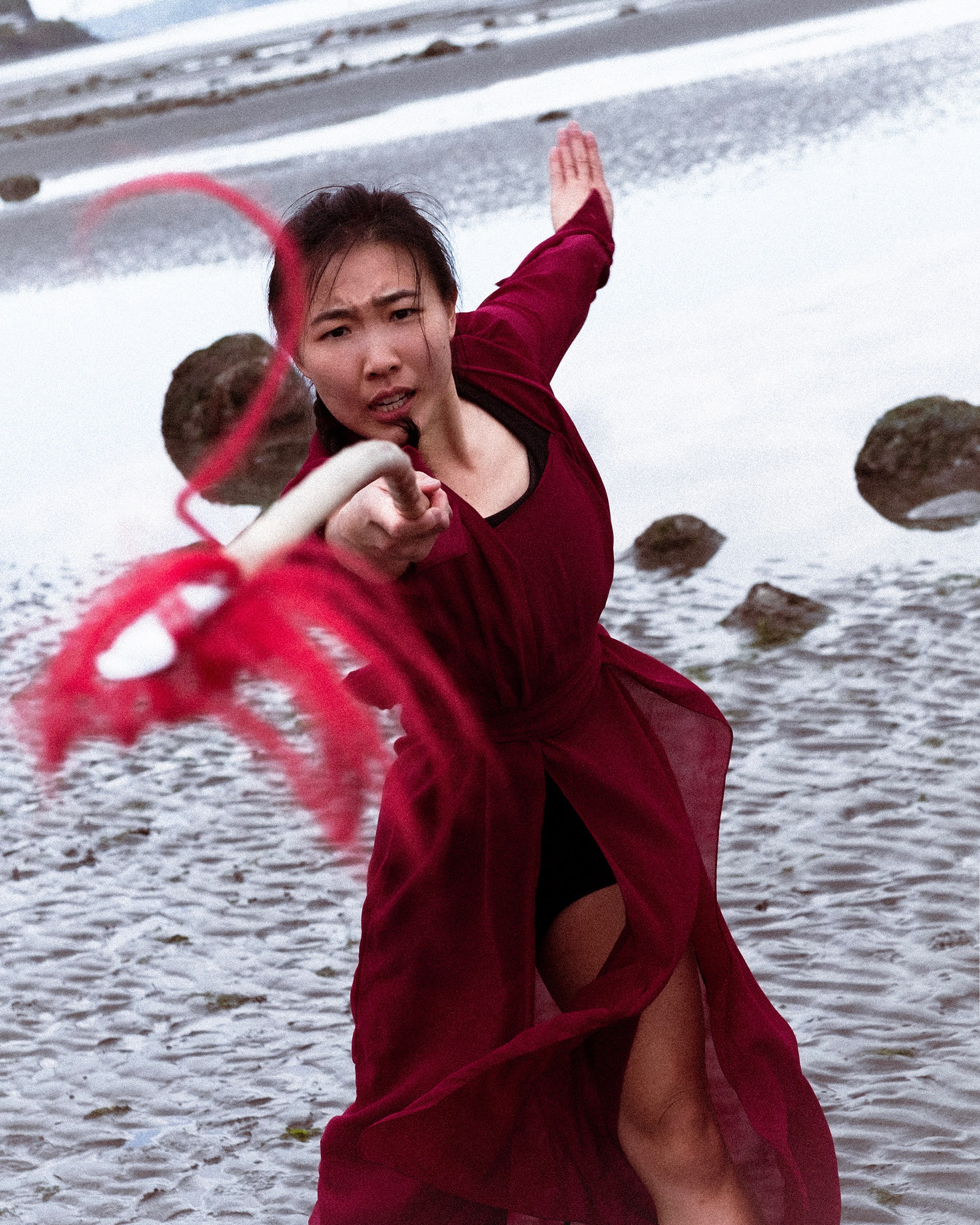 Chainwhip strike pose on a beach