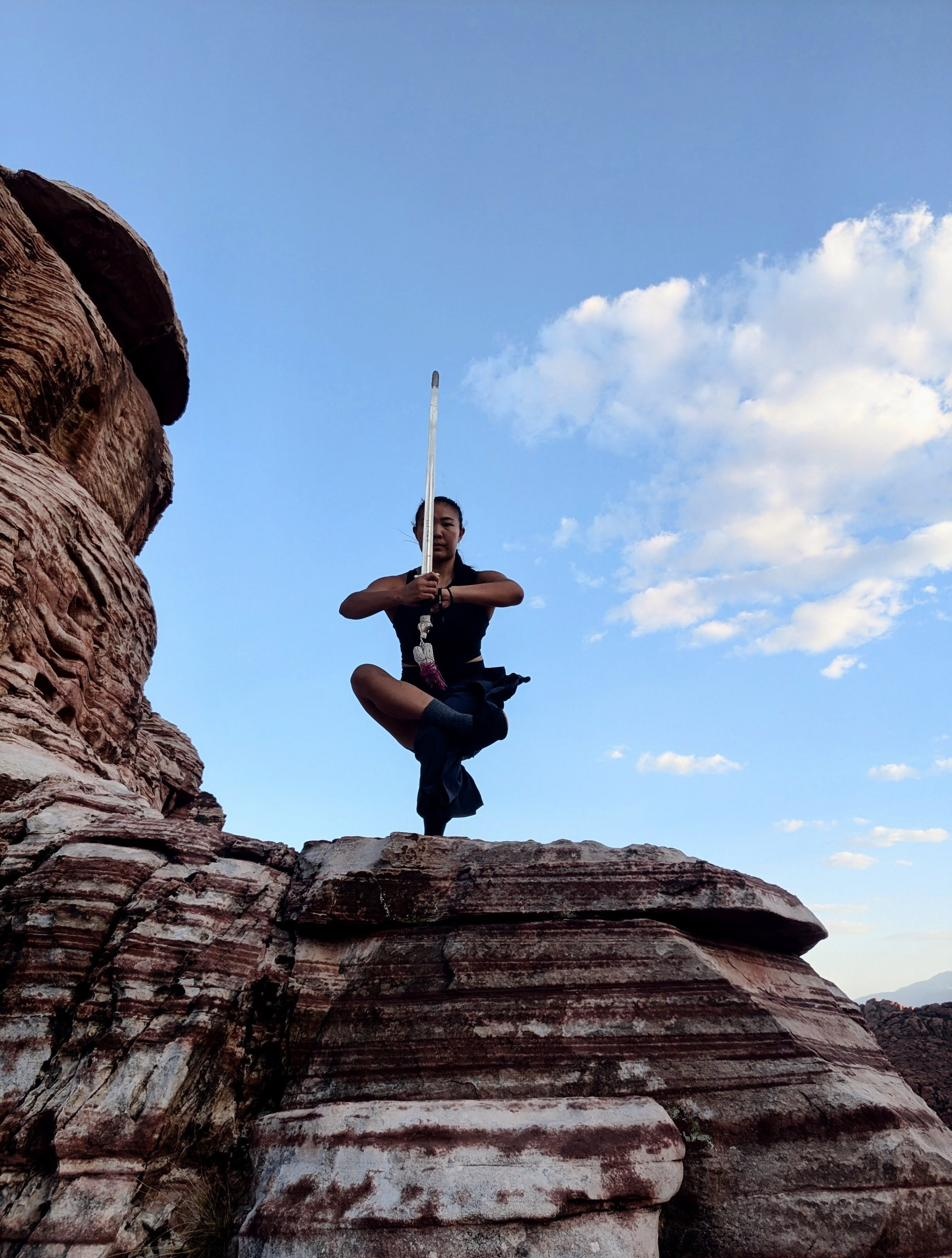 Crane balance pose with sword at Red Rock Canyon